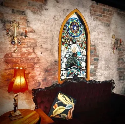 Dark Arts Cafe & Bar logo